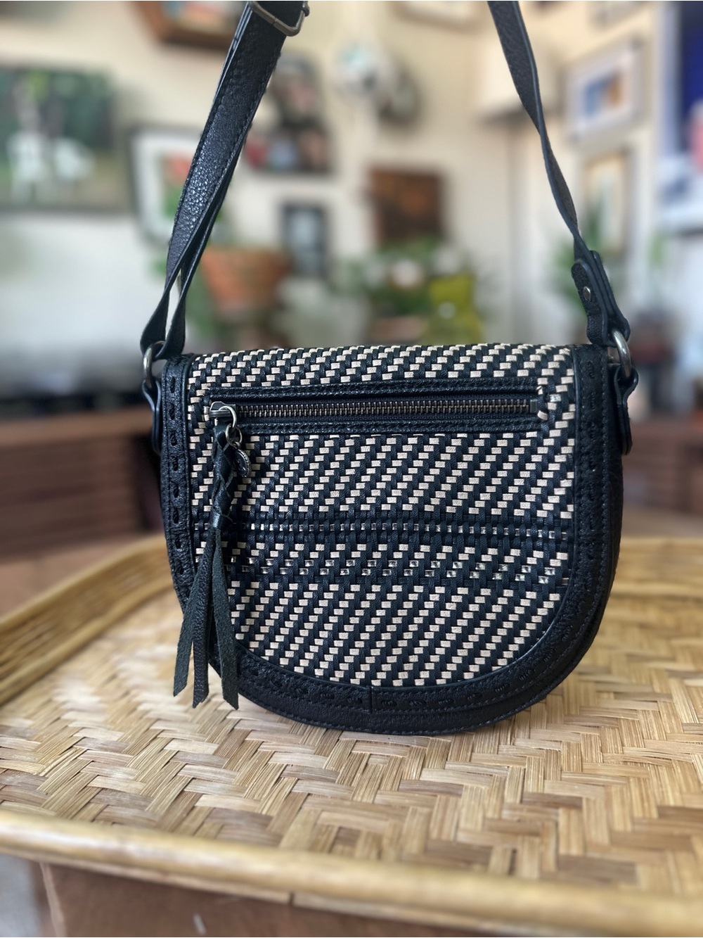 The Sak Black & Cream Woven Crossbody Saddle Bag